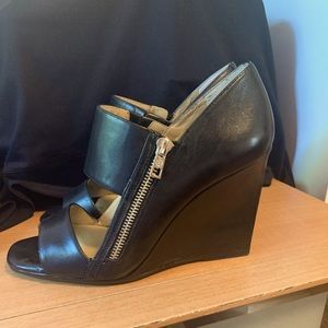 Any Taylor Kristen side zip leather wedge sandal.Gently used but brand new soles